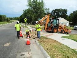 Workers Repair Street Corner